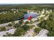 Aerial view showing building location near lake at 3133 Lake Pine Way # D1, Tarpon Springs, FL 34688