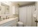 Clean bathroom with white vanity and shower/tub combo at 3133 Lake Pine Way # D1, Tarpon Springs, FL 34688