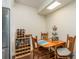 Small kitchen nook with wooden table and chairs at 3133 Lake Pine Way # D1, Tarpon Springs, FL 34688