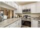 Updated kitchen with granite countertops and stainless steel appliances at 3133 Lake Pine Way # D1, Tarpon Springs, FL 34688