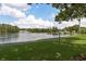 Scenic lakefront path with lush landscaping at 3133 Lake Pine Way # D1, Tarpon Springs, FL 34688