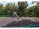playground with slide, seesaw, and play area at 3133 Lake Pine Way # D1, Tarpon Springs, FL 34688