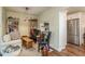 Cozy sitting area with built-in bookshelves and a view into the kitchen at 3133 Lake Pine Way # D1, Tarpon Springs, FL 34688