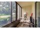 Relaxing sunroom with seating and tranquil outdoor view at 3133 Lake Pine Way # D1, Tarpon Springs, FL 34688