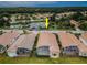 An aerial view of a home showing the roof, the landscape, and the screen enclosed patio at 4350 Live Oak Blvd, Palm Harbor, FL 34685