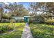 Charming ranch home with teal door and walkway at 509 Langford Cir, Plant City, FL 33563