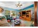 Living room features wood entertainment center and comfy seating at 509 Langford Cir, Plant City, FL 33563