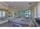 Bright gym with free weights, cardio equipment, and fitness accessories for residents at 8125 Stone Path Way, Tampa, FL 33647