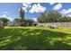 Large grassy backyard with covered patio, fire pit and pool at 1043 60Th N Ave, St Petersburg, FL 33703