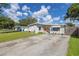 Mid-century home with a spacious yard and driveway at 1043 60Th N Ave, St Petersburg, FL 33703