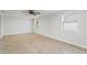 Spacious living area with tile floors and ceiling fan at 4210 W Bay Vista Ave, Tampa, FL 33611