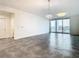 Bright living room with tile floors and sliding glass doors leading to a balcony at 920 N Osceola Ave # 703, Clearwater, FL 33755