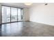 Modern living room with tile floors and sliding glass doors with city views at 920 N Osceola Ave # 703, Clearwater, FL 33755