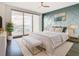 Bright bedroom with water views and geometric wall at 920 N Osceola Ave # 703, Clearwater, FL 33755
