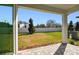 Covered patio overlooking a grassy backyard at 13728 Sunlight Meadow Dr, Riverview, FL 33578