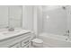 Clean bathroom featuring white vanity, bathtub, and tile at 13728 Sunlight Meadow Dr, Riverview, FL 33578