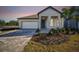 Two-story home with a covered porch and garage at 13728 Sunlight Meadow Dr, Riverview, FL 33578