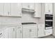 Modern kitchen with white cabinets, gas cooktop, and double oven at 13728 Sunlight Meadow Dr, Riverview, FL 33578