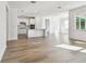 Spacious living room with hardwood floors and abundant natural light at 13728 Sunlight Meadow Dr, Riverview, FL 33578