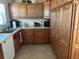 Bright kitchen with wood cabinets and ample counter space at 7809 39Th N Ave, St Petersburg, FL 33709