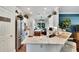 Well-lit kitchen with granite countertops and a stainless steel refrigerator at 11335 Flora Springs Dr, Riverview, FL 33579