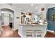 Modern kitchen featuring white cabinetry, stainless steel appliances, and stone countertops at 11335 Flora Springs Dr, Riverview, FL 33579