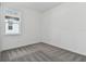 Bright bedroom with grey carpet and a window offering natural light at 13808 Sunlight Meadow Dr, Riverview, FL 33578