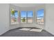 Bright bedroom with a bay window and gray carpeting at 13808 Sunlight Meadow Dr, Riverview, FL 33578