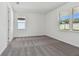 Well-lit bedroom with grey carpet and large windows at 13808 Sunlight Meadow Dr, Riverview, FL 33578