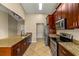 Modern kitchen with granite countertops and stainless steel appliances at 651 Lakemont Dr, Brandon, FL 33510