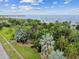 Lush tropical park with palm trees and walking path at 1120 N Shore Ne Dr # 703, St Petersburg, FL 33701