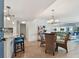 Bright dining area with glass-top table and wicker chairs, near kitchen at 1120 N Shore Ne Dr # 703, St Petersburg, FL 33701