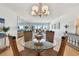 Bright dining room with glass-top table and wicker chairs at 1120 N Shore Ne Dr # 703, St Petersburg, FL 33701