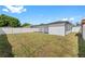 Spacious backyard with a large covered patio and a fenced in area at 2906 W Braddock St, Tampa, FL 33607