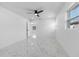 Bright bedroom with marble floors and ceiling fan at 2906 W Braddock St, Tampa, FL 33607