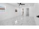 Bedroom with marble floors and ceiling fan at 2906 W Braddock St, Tampa, FL 33607