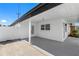 Modern front entrance with dark brown door and sidelight, covered entryway at 2906 W Braddock St, Tampa, FL 33607