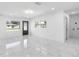 Open living space showcasing marble floors and a view of the front yard at 2906 W Braddock St, Tampa, FL 33607