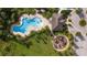 Aerial view of community pool, playground, and clubhouse at 3948 Mossy Limb Ct, Palmetto, FL 34221