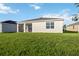 Large backyard with grassy area and home at 3948 Mossy Limb Ct, Palmetto, FL 34221