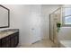 Bathroom features granite countertop, walk-in shower and soaking tub at 3948 Mossy Limb Ct, Palmetto, FL 34221