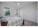 Bright bedroom with double windows and wood-look floors at 3948 Mossy Limb Ct, Palmetto, FL 34221