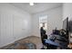 Bedroom with wood-look floors and double door closet at 3948 Mossy Limb Ct, Palmetto, FL 34221