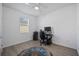 Bedroom with wood-look floors and a workspace setup at 3948 Mossy Limb Ct, Palmetto, FL 34221