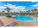 Resort-style pool with lounge chairs and palm trees at 6223 Distant Haze Pl, Palmetto, FL 34221