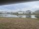 View of a community lake with houses reflecting on the water at 6223 Distant Haze Pl, Palmetto, FL 34221