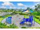 Modern playground with climbing wall and shade structure at 6223 Distant Haze Pl, Palmetto, FL 34221