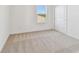 Bright bedroom featuring neutral carpeting and a large closet at 13810 Sunlight Meadow Dr, Riverview, FL 33578