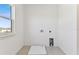 Simple laundry room with space for a washer and dryer at 13810 Sunlight Meadow Dr, Riverview, FL 33578