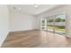 Bright and spacious living room with sliding glass doors at 13810 Sunlight Meadow Dr, Riverview, FL 33578